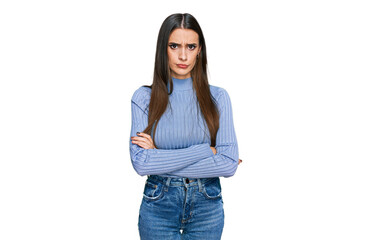 Young beautiful woman wearing casual winter sweater skeptic and nervous, disapproving expression on face with crossed arms. negative person.