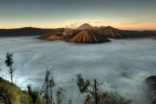 A sea of clouds covers the caldera at sunrise in Bromo-Tengger-Semeru National Park on the island of Java in Indonesia      