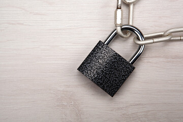 padlock with with a steel chain closeup top view