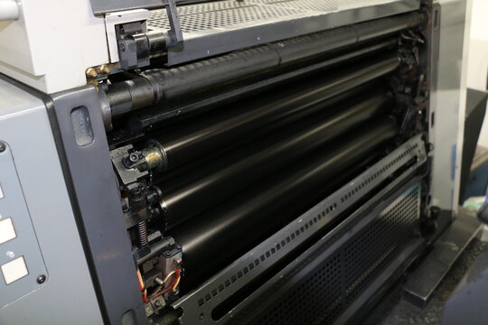 Black painted roller system of the printing machine in Matbaa. Komori lithrone. selective focus
