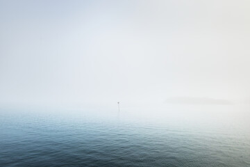 Panoramic view of the North sea in a fog. Norway. Still water surface texture. Blue, azure,...