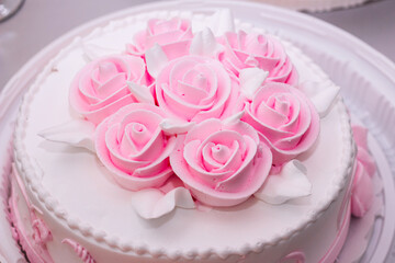 festive cake with cream roses