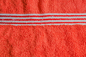 red towel with striped border patterns