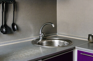 Fragment of home cooking. Mixer and sink in the kitchen.