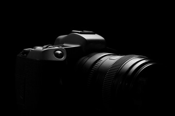 dslr photo camera body silhouette on black background