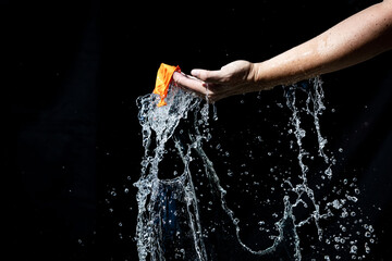 Splashes of water falling after the balloon bursts 