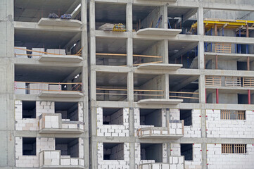 The facade of modern residential building under construction