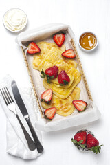 Homemade rghaif or msemen Arab with honey and cream cheese