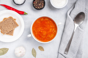 Traditional ukrainian russian soup (borscht) with bread and sour cream