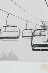 Ski Lift in Snowy and Foggy Weather