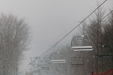 Ski Lift in Snowy and Foggy Weather