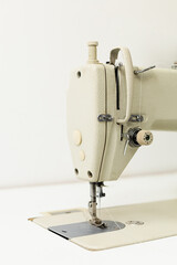 Industrial sewing machine on a white background
