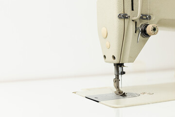 Industrial sewing machine on a white background