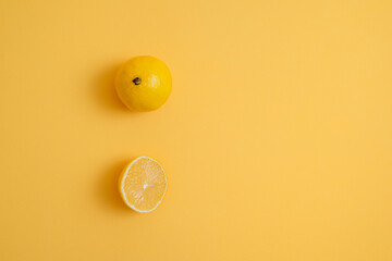 cut lemon on a yellow background. slice of fresh fruit. vitamins, diet food