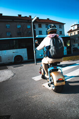 person riding a scooter