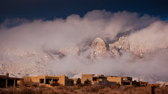 mountain view with adobe homes in winter 