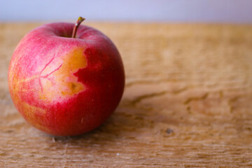 Red apple stand on a wooden surface