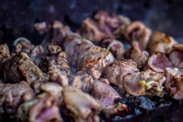 Fresh shish kebab on skewers is fried on the grill. Grilled meat on skewers.