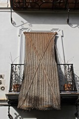 Typical balcony with sun shade in Sevilla, Andalusia 
