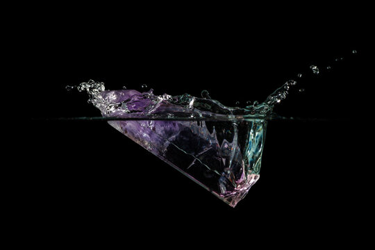 Purple Quartz Crystal Falling Into Water