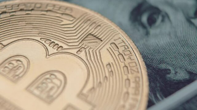 Bitcoin, a cryptocurrency equivalent to a dollar, a hundred dollars. Future of virtual concept. World currency. Close-up