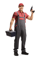 Full length portrait of a repairman with a tool box and a drill