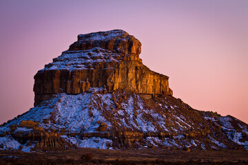 Fajada Butte glows in the soft, pastel colors of dusk at Chaco Culture National Historic Park, New Mexico.
