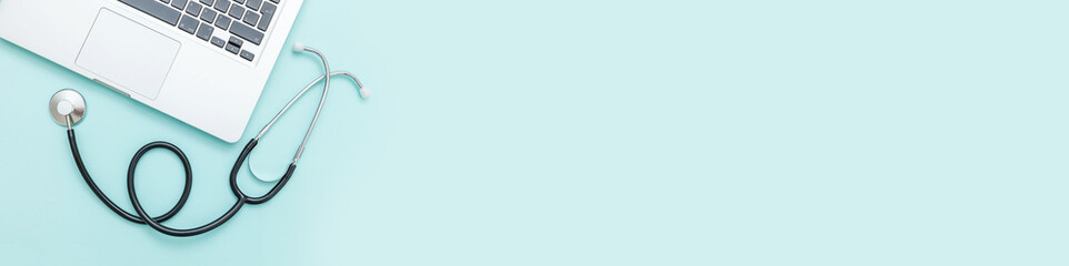 Stethoscope keyboard laptop computer isolated on blue background. Modern medical Information...