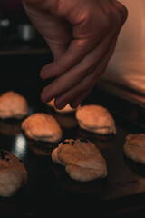 The woman is making pastry in the kitchen