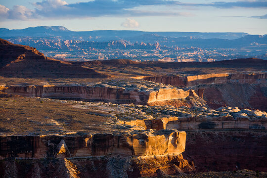 Views of the Needles and Maze districts at sunset as seen from the Murphy Hogback campsite on the White Rim Trail in Canyonlands National Park, Utah.       