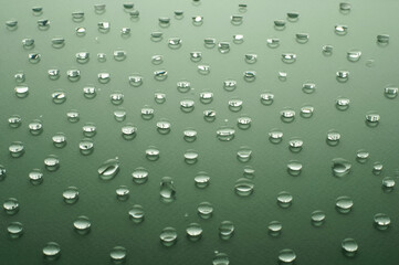 Water drops on green background. beauty and spa concept.copy space. raindrops on glossy background
