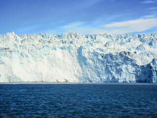 Glacier in Greenland within area of Disko bay with blue and white colors 