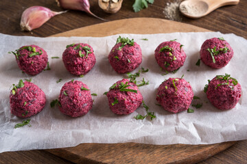 Georgian beetroot phali or pkhali with walnuts, garlic and spices on wooden background.