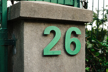 Number 26 in green color