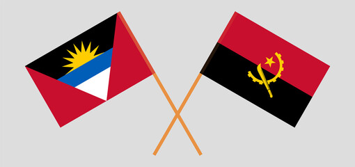 Crossed flags of Antigua and Barbuda and Angola. Official colors. Correct proportion