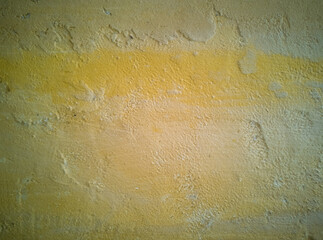Yellow aged cement wall texture background