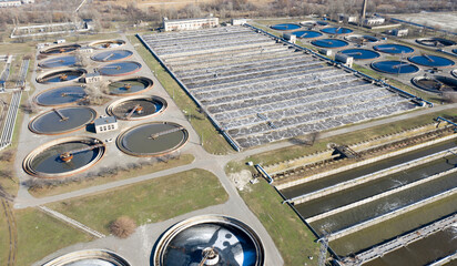 Aerial top down view on sewage treatment facilities. water purification tanks and aeration basins at modern wastewater plant