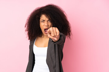 Young african american woman over isolated background frustrated and pointing to the front