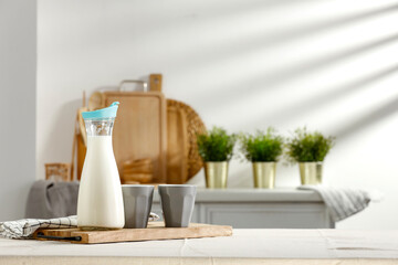Spring table in the kitchen with the rays of the morning sun and kitchen attributes 