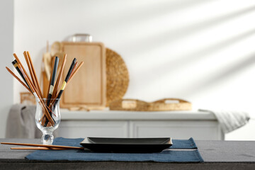 Spring table in the kitchen with the rays of the morning sun and kitchen attributes 