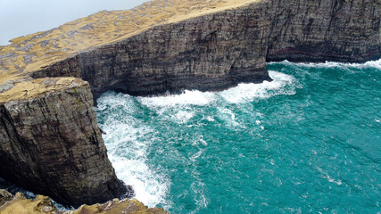 lake over the cliffs at the stormy sea