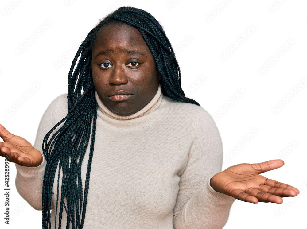 Sticker young black woman with braids wearing casual winter sweater clueless and confused expression with ar