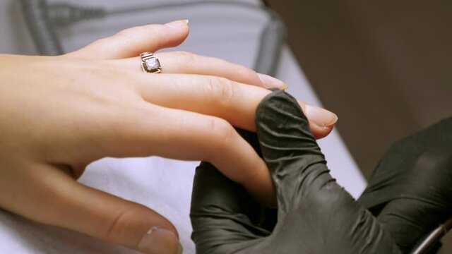 Manicure process. Painting gel polish on female nails