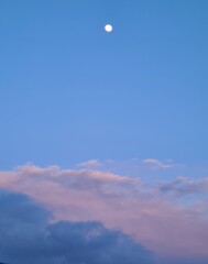 little moon and clouds over the sky