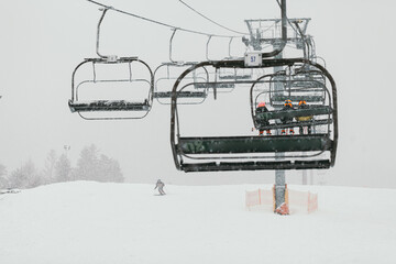 Ski Lift in Snowy and Foggy Weather