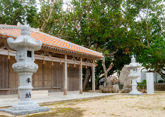 Traditional wooden temple among the trees in Ishigaki town on Ishigaki Island in Japan