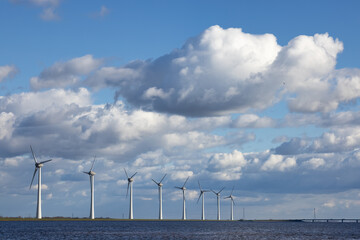 Dutch coast with wind turbines and beautiful cloudy sky