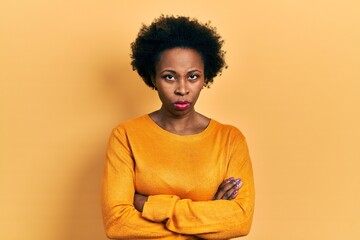 Fototapeta na wymiar Young african american woman wearing casual clothes skeptic and nervous, disapproving expression on face with crossed arms. negative person.