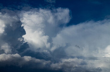 Obraz premium Incredible fluffy clouds called cumulus. Large clouds of water in the form of steam.