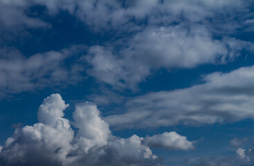 Obraz premium Incredible fluffy clouds called cumulus. Large clouds of water in the form of steam.